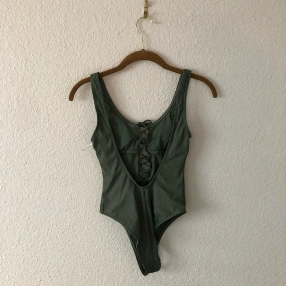 Xhiliration Green Ribbed Plunge One Piece NWOT